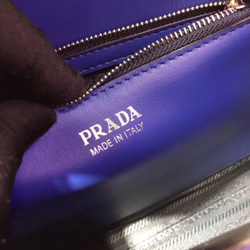 pra*a monoCh*0me top handle bag in blue saffiano leather