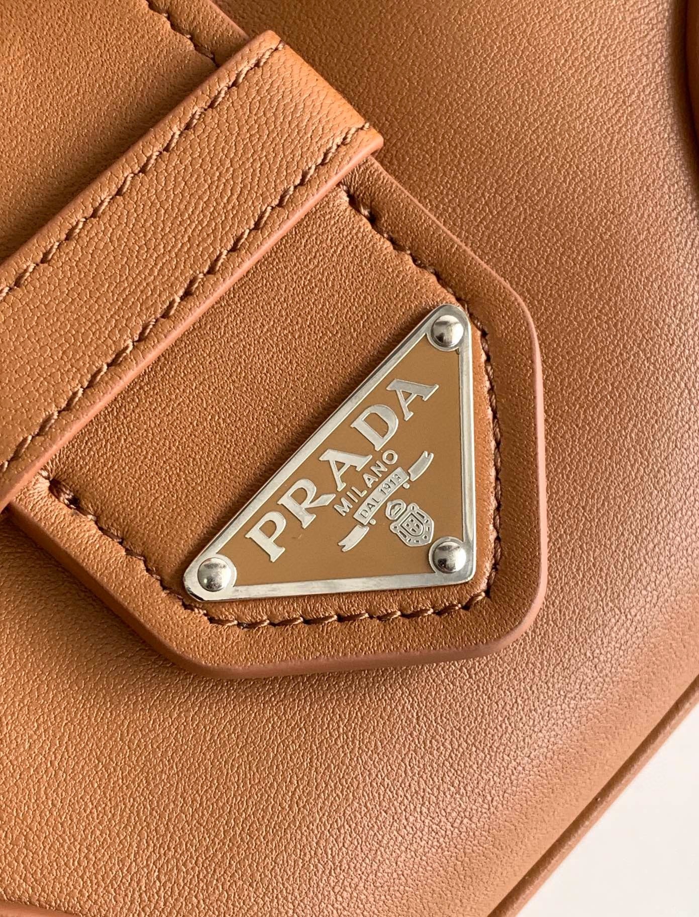 Pra*a moon bag in caramel padded nappa leather