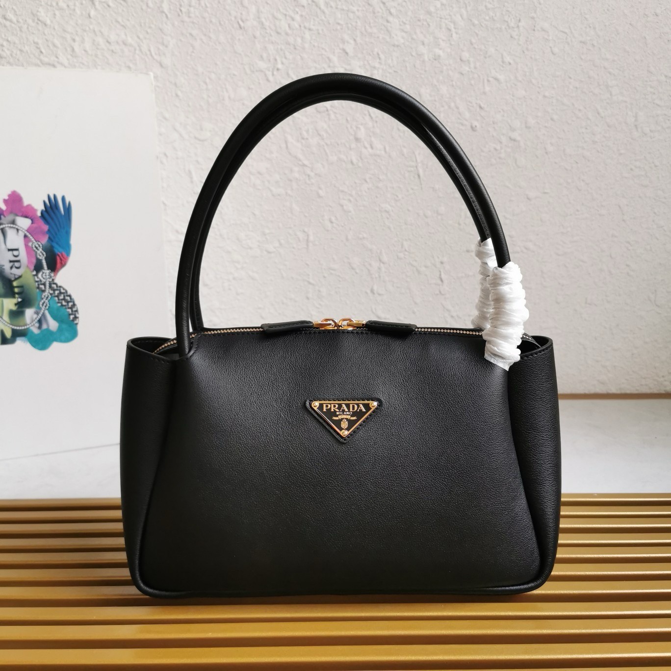 Pra*a shoulder bag in black calfskin with triangle logo