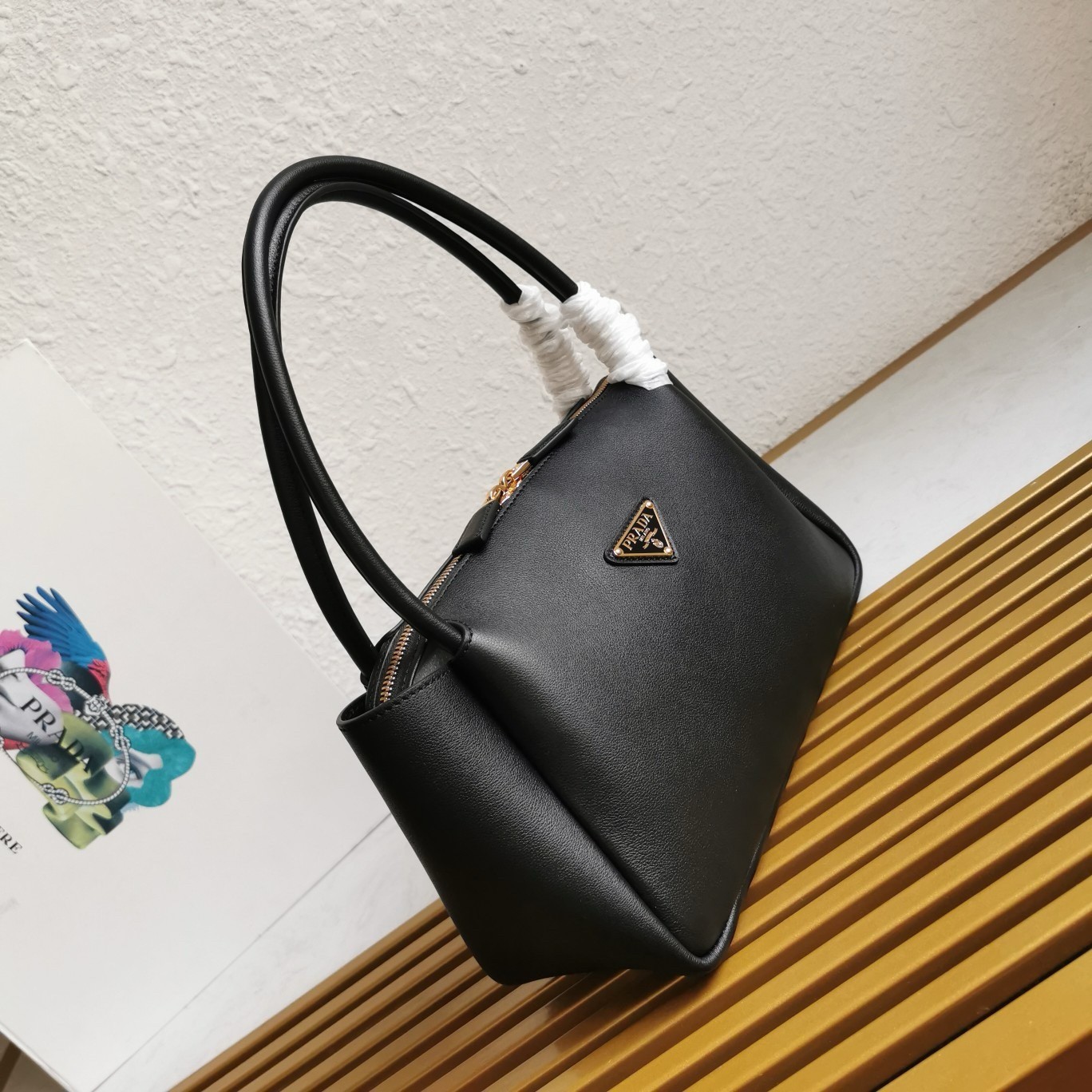 Pra*a shoulder bag in black calfskin with triangle logo