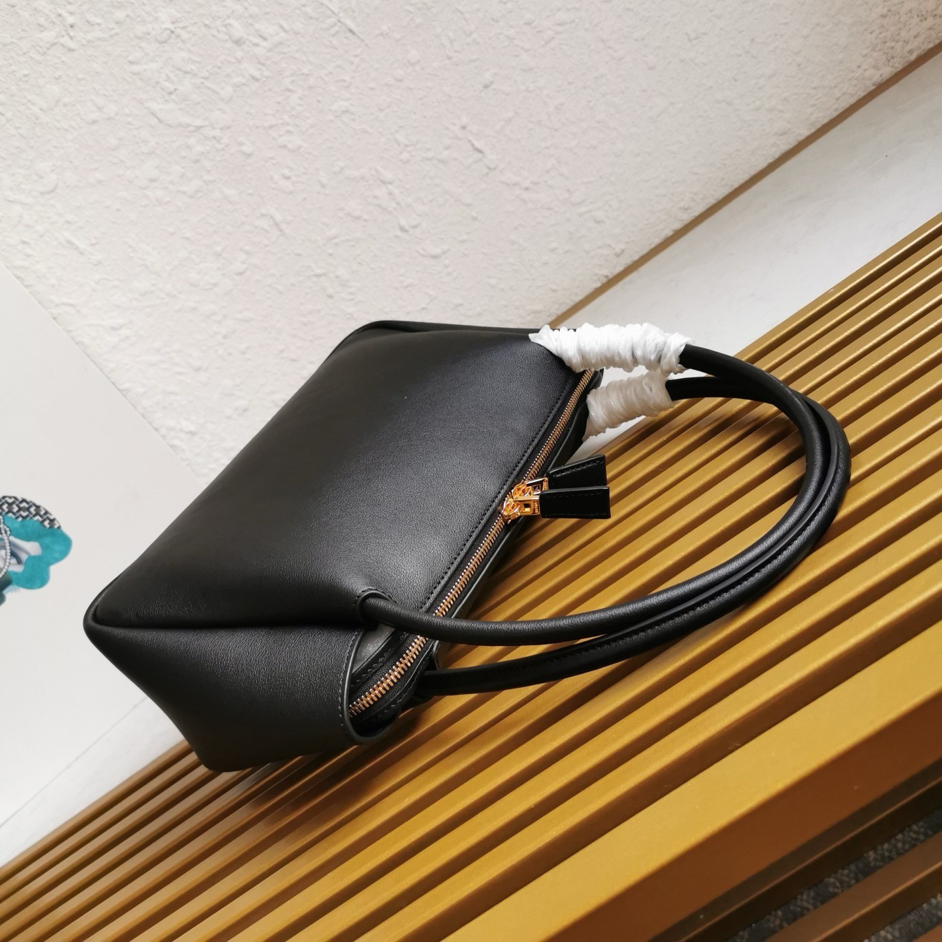 Pra*a shoulder bag in black calfskin with triangle logo