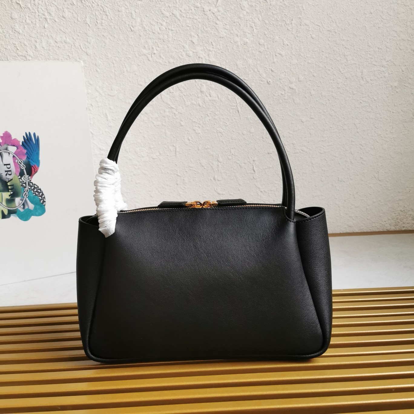 Pra*a shoulder bag in black calfskin with triangle logo