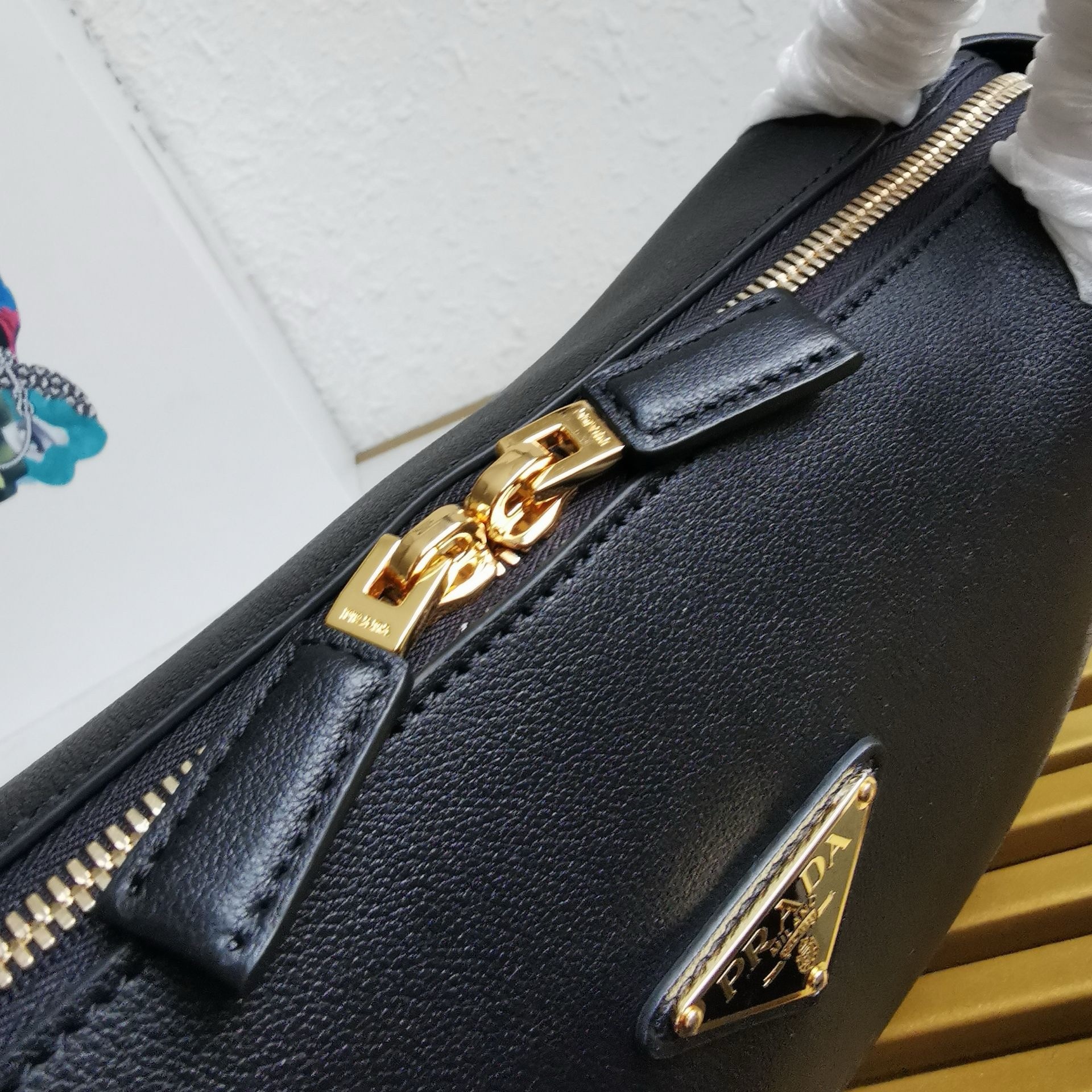 Pra*a shoulder bag in black calfskin with triangle logo