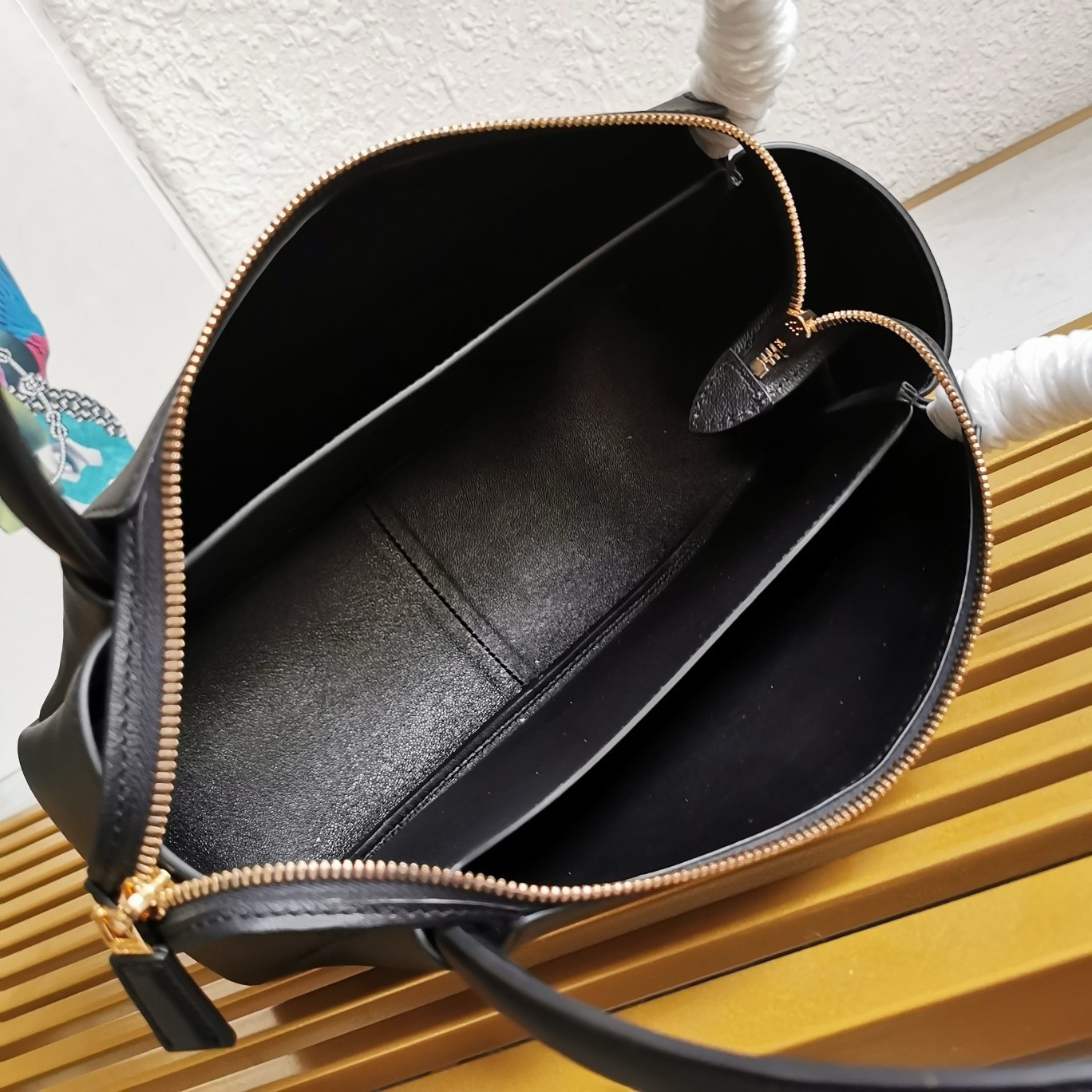 Pra*a shoulder bag in black calfskin with triangle logo