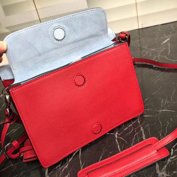 Pra*a etiquette bag in red calfskin with metal stud trim