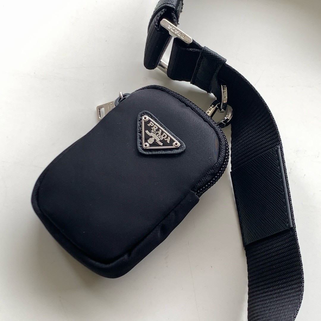 Pra*a shoulder bag with flap in black re-nylon