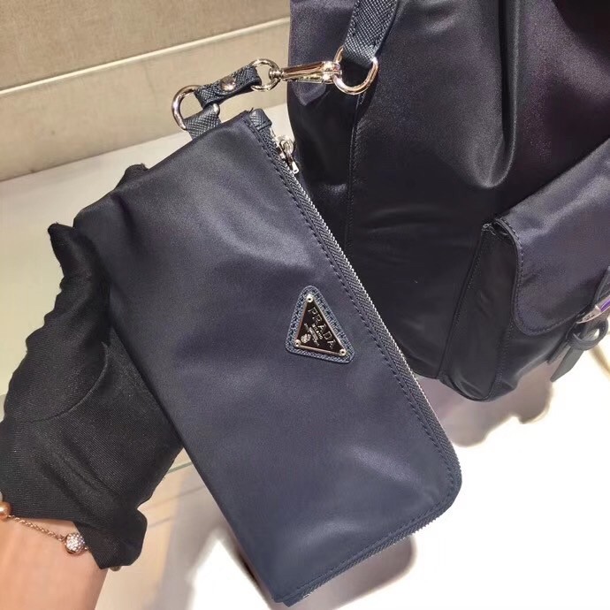 Pra*a navy blue nylon backpack with clutch