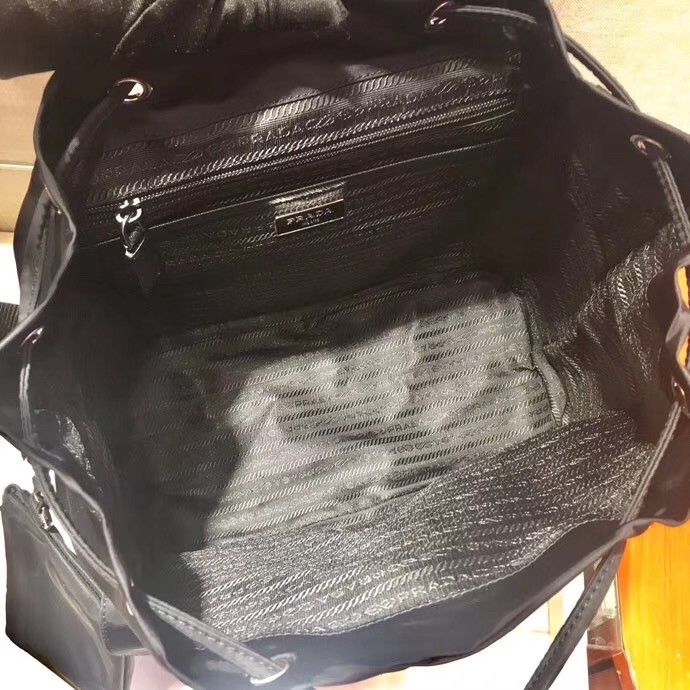 Pra*a black nylon backpack with clutch