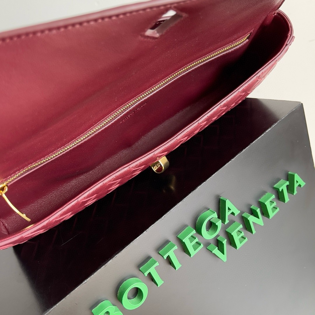 bo*te*ga Ve*ne*ta andiamo clutch with handle in barolo intrecciato lambskin