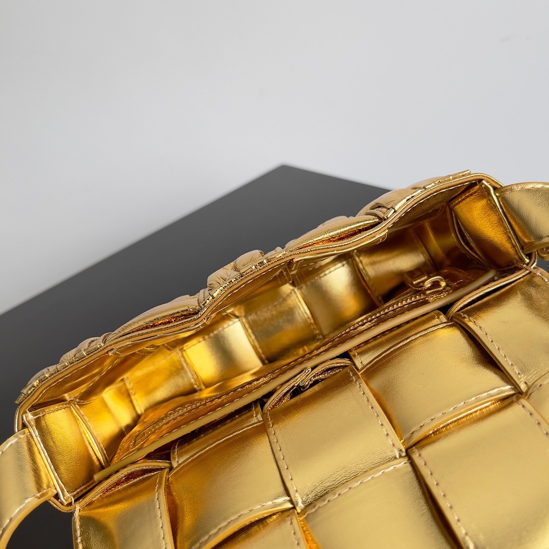 bo*te*ga Ve*ne*ta small cassette bag in gold metallic lambskin