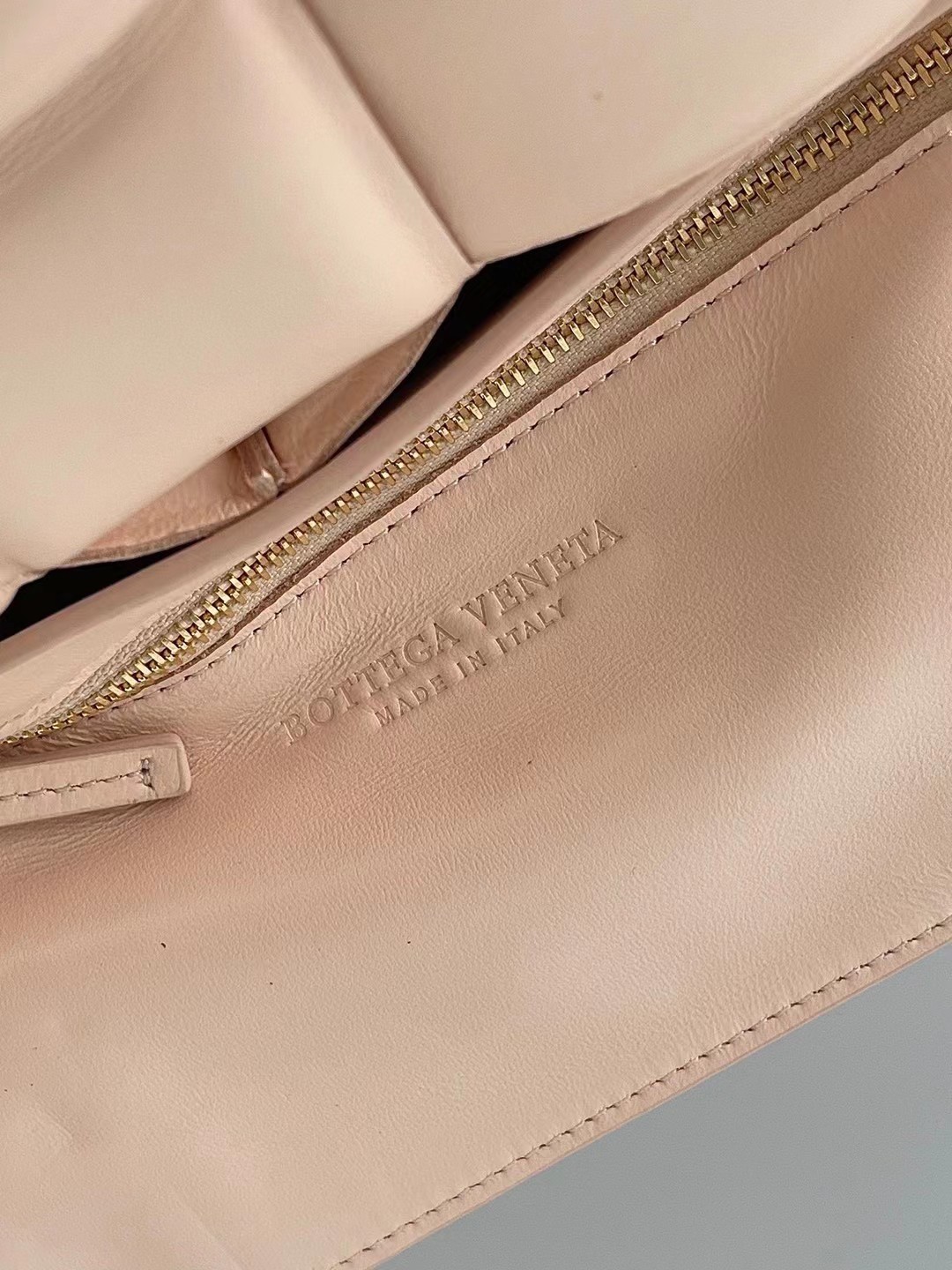 bo*te*ga Ve*ne*ta padded cassette bag in melon lambskin