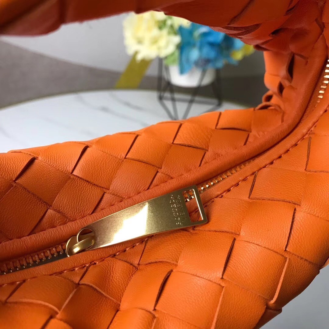 bo*te*ga Ve*ne*ta mini bv jodie bag in orange woven leather