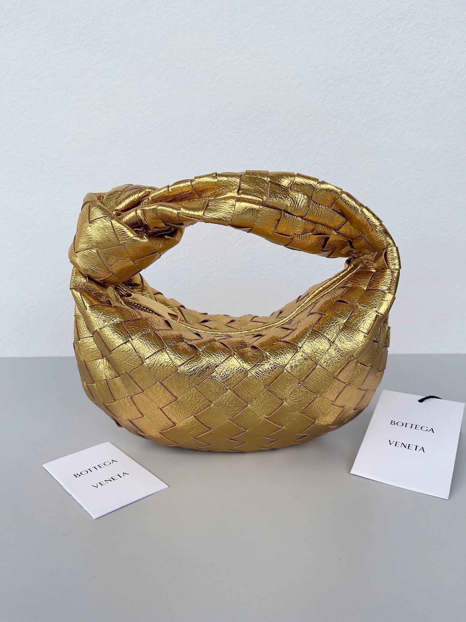 bo*te*ga Ve*ne*ta bv jodie mini bag in gold metallic intrecciato leather