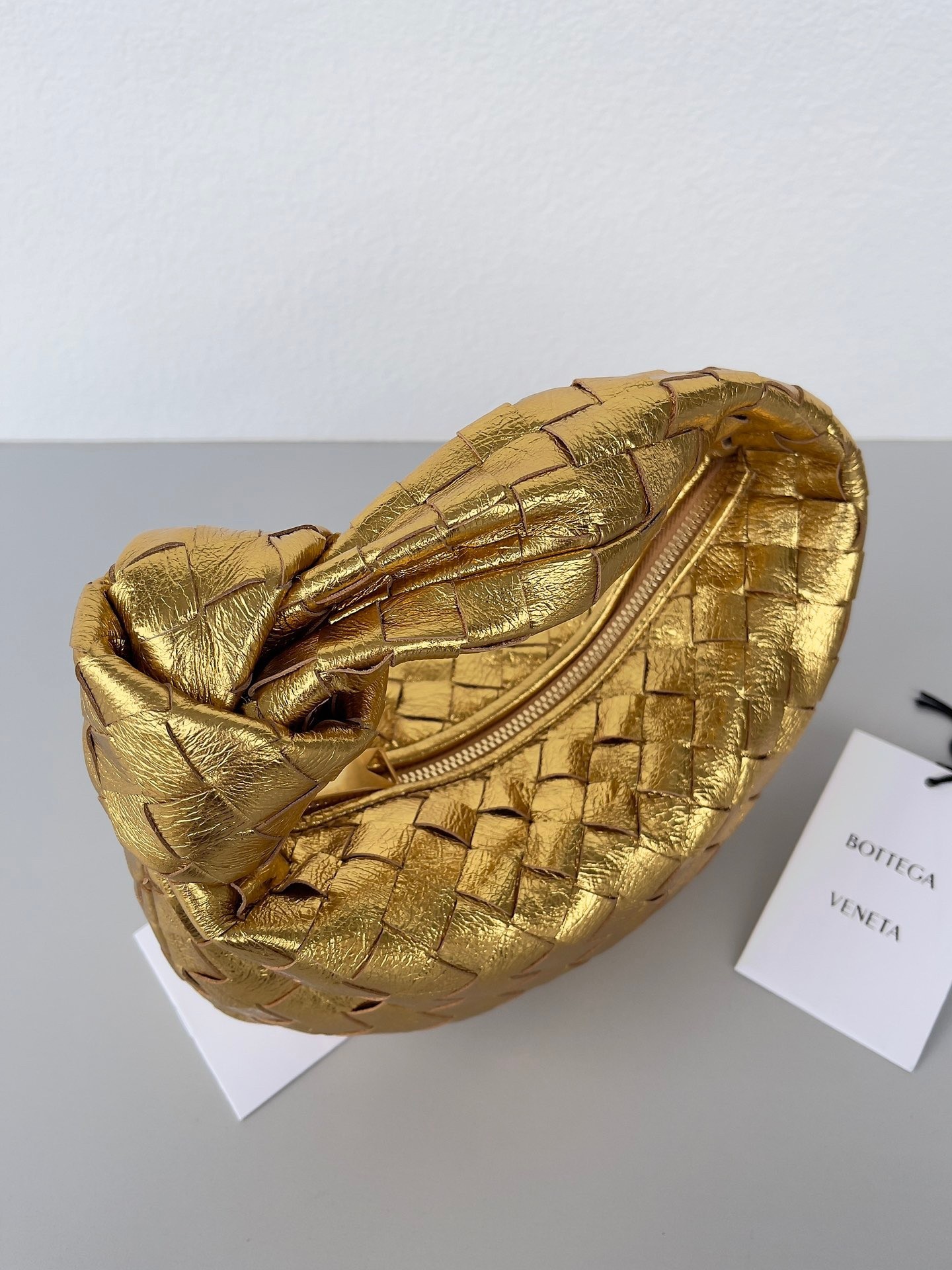 bo*te*ga Ve*ne*ta bv jodie mini bag in gold metallic intrecciato leather