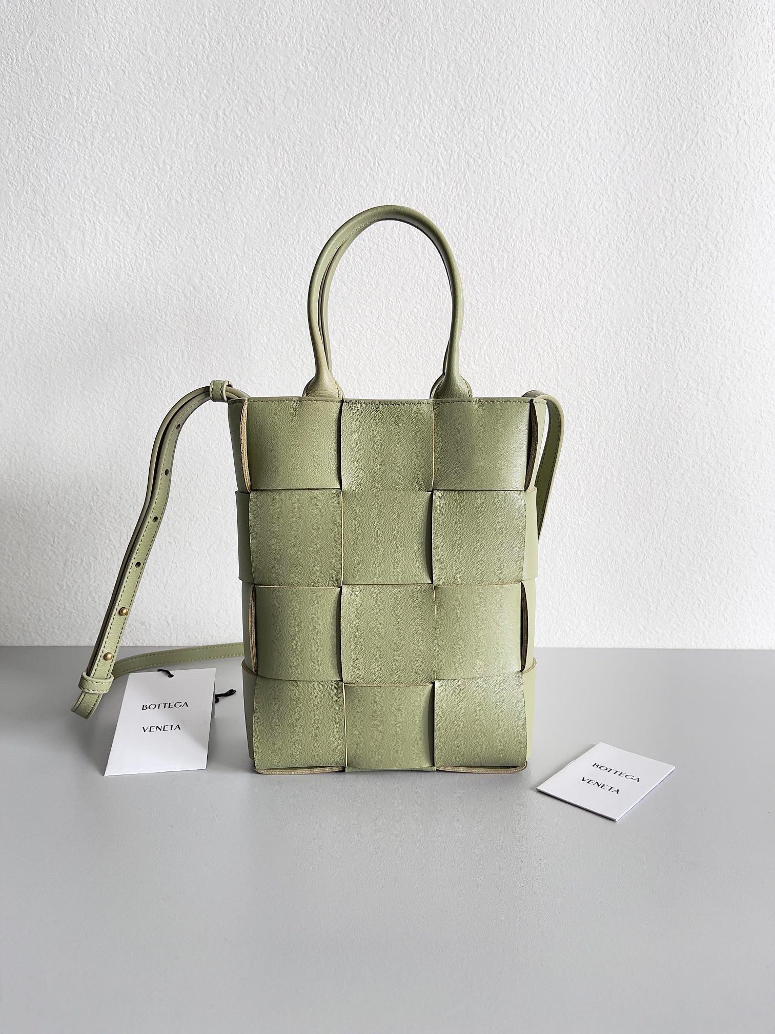 bo*te*ga Ve*ne*ta mini cassette tote bag in travertine lambskin