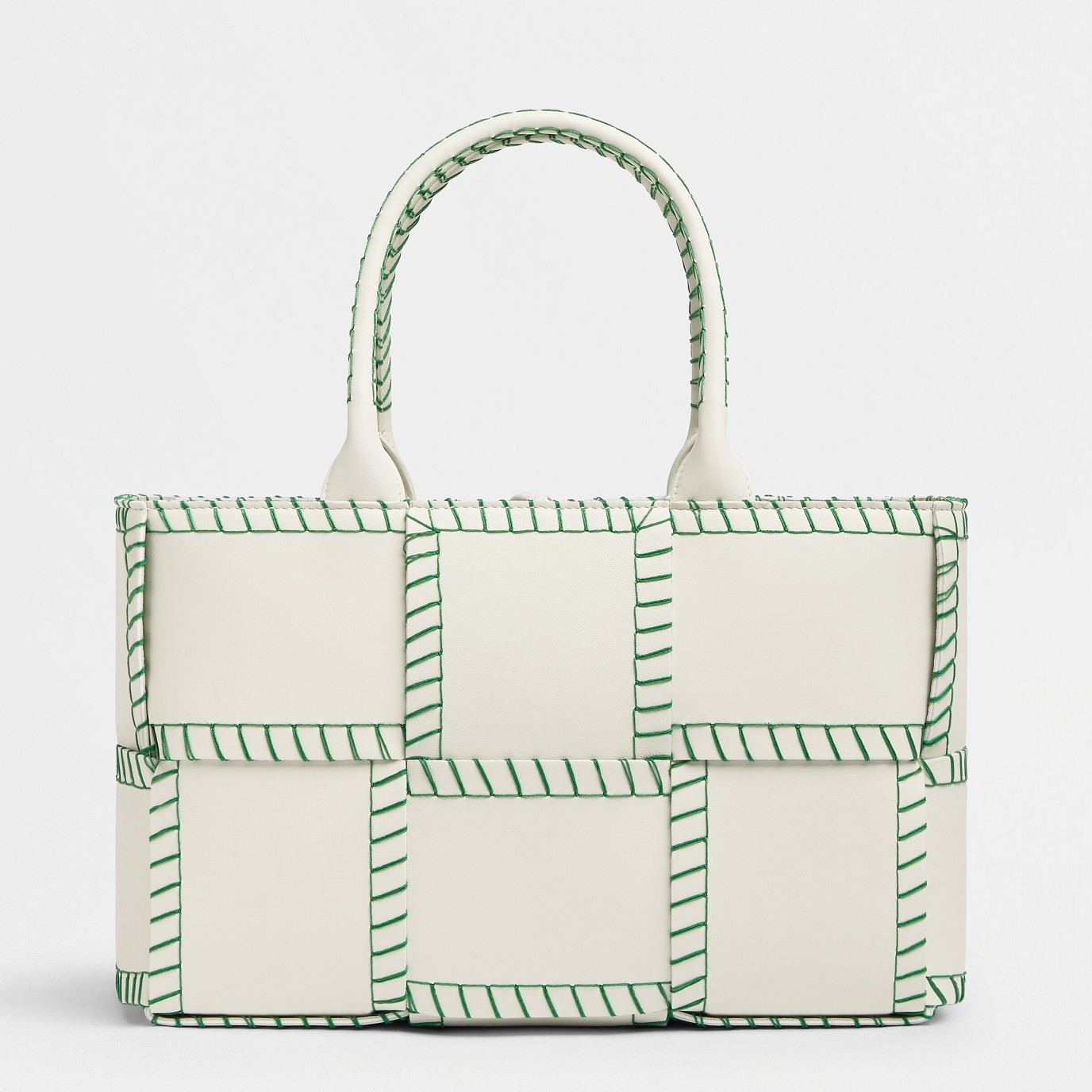 bo*te*ga Ve*ne*ta white arco small tote with green overlock stitching