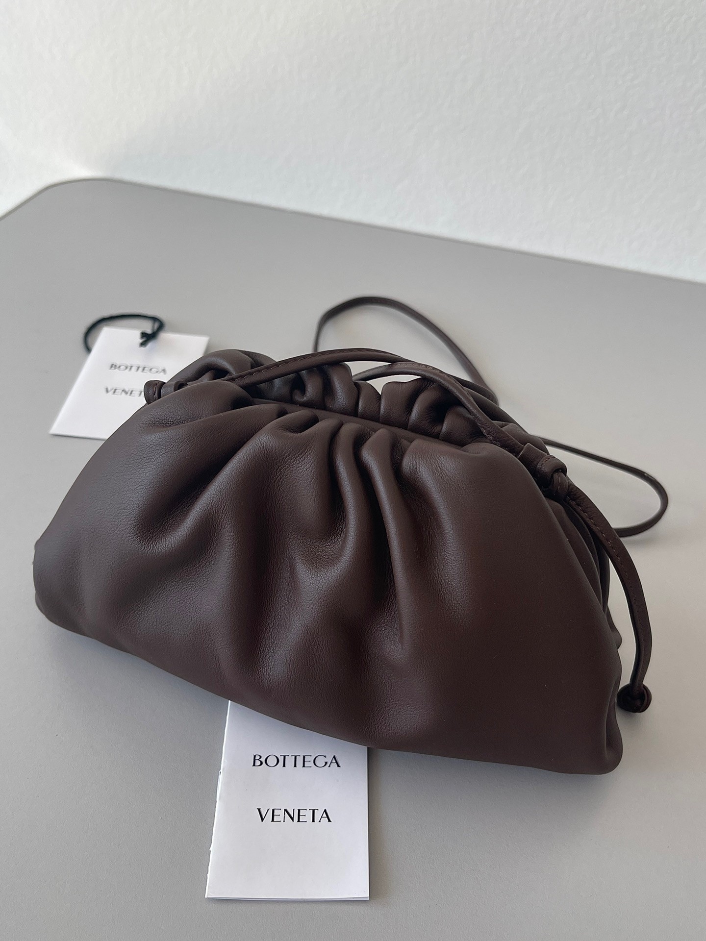 bo*te*ga Ve*ne*ta mini pouch bag in fondant calfskin