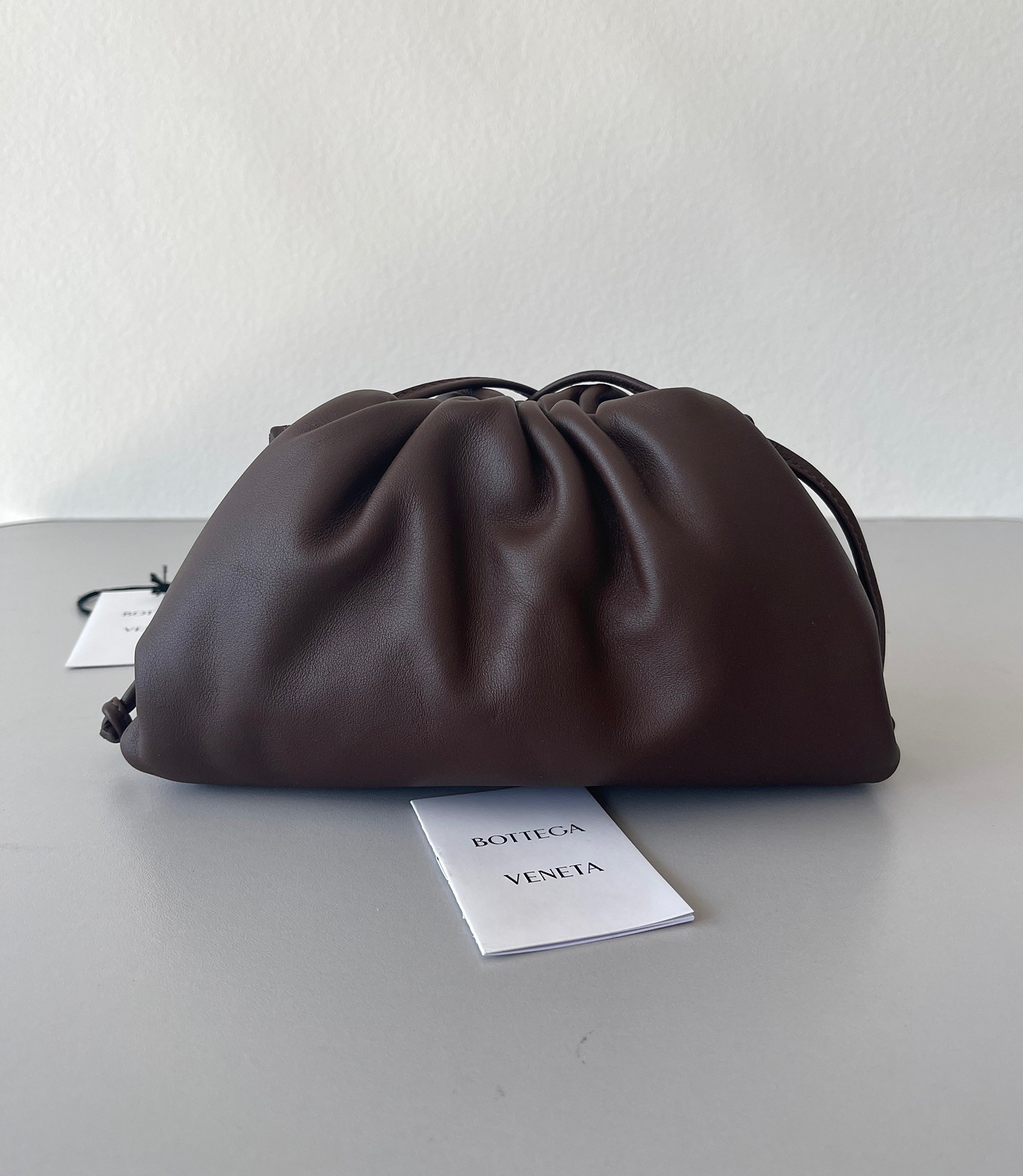 bo*te*ga Ve*ne*ta mini pouch bag in fondant calfskin