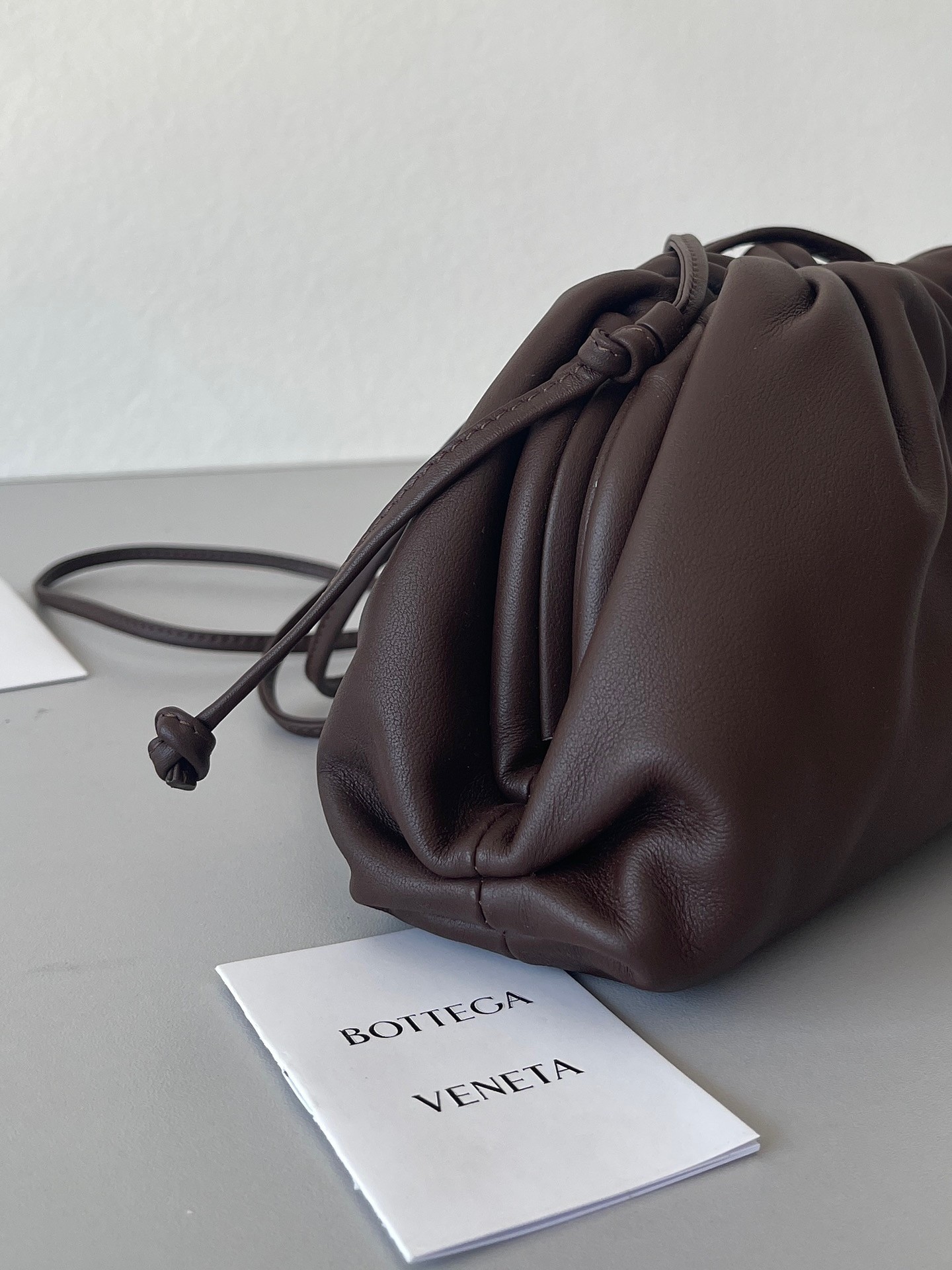 bo*te*ga Ve*ne*ta mini pouch bag in fondant calfskin