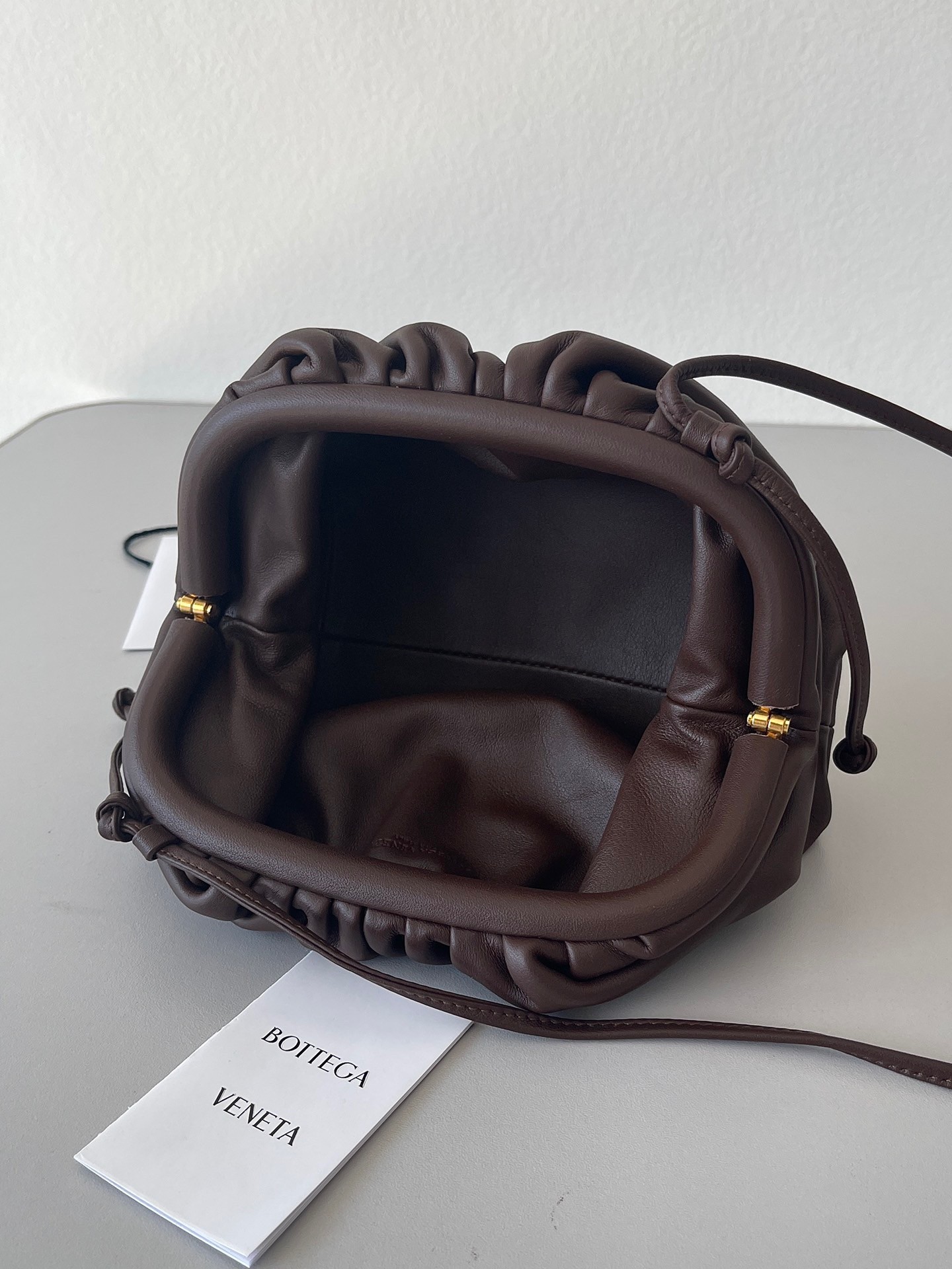 bo*te*ga Ve*ne*ta mini pouch bag in fondant calfskin