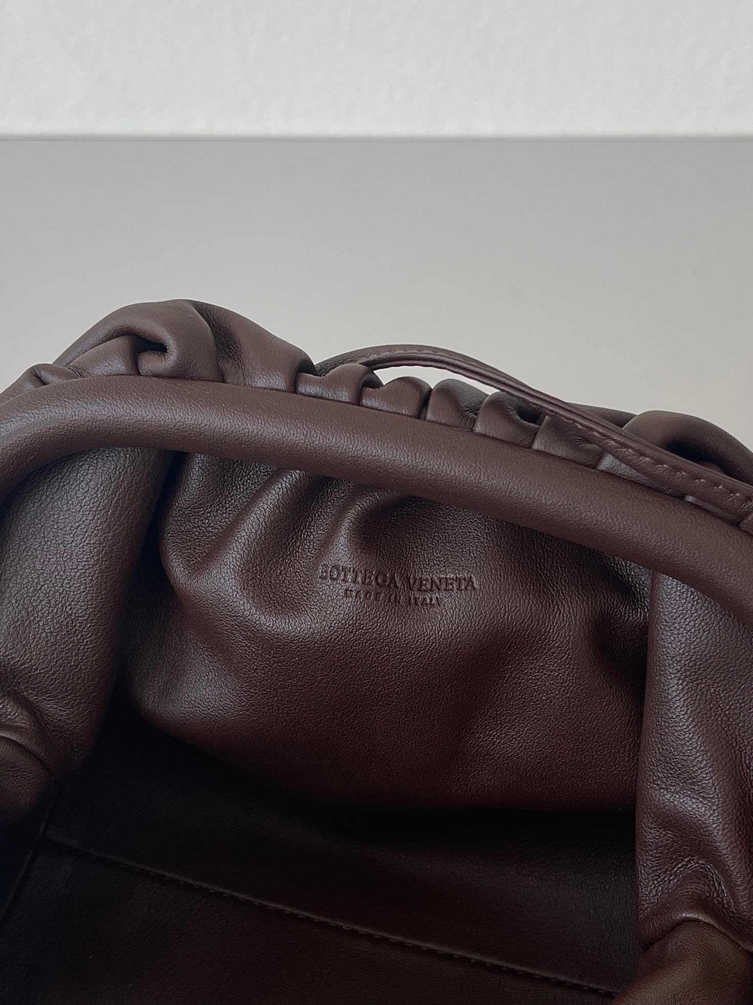 bo*te*ga Ve*ne*ta mini pouch bag in fondant calfskin
