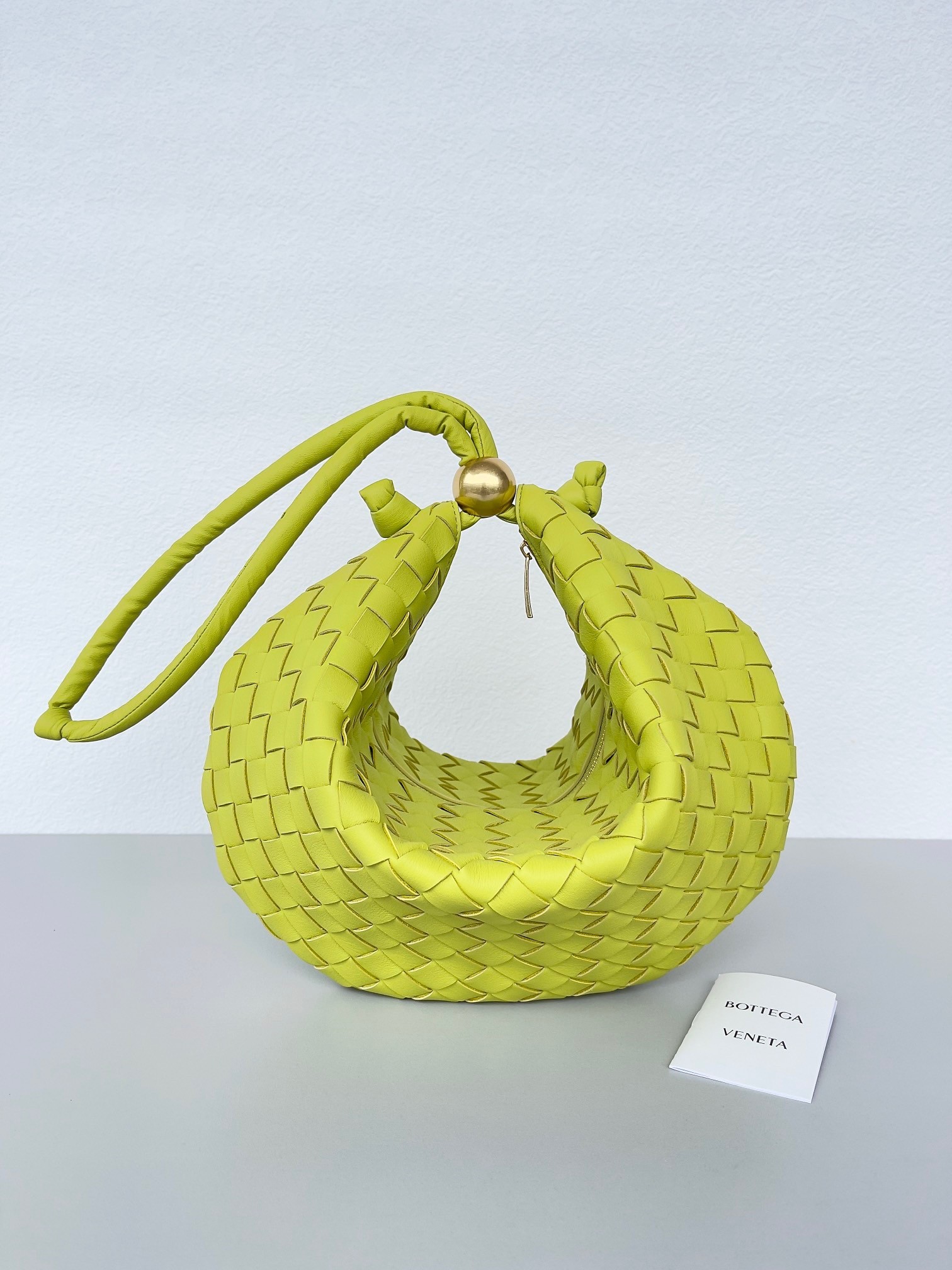 bo*te*ga Ve*ne*ta turn bag in acid kiwi intrecciato lambskin