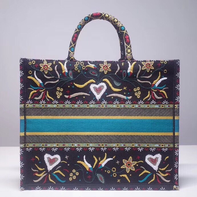 d*or book tote bag in flowers and He**ts canvas