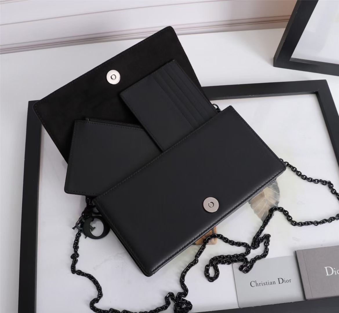 d*or lady d*or pouch in black Di*m*nd calfskin