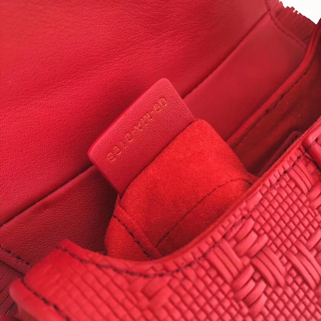 D*or saddle bag in red braided leather strips with fringe