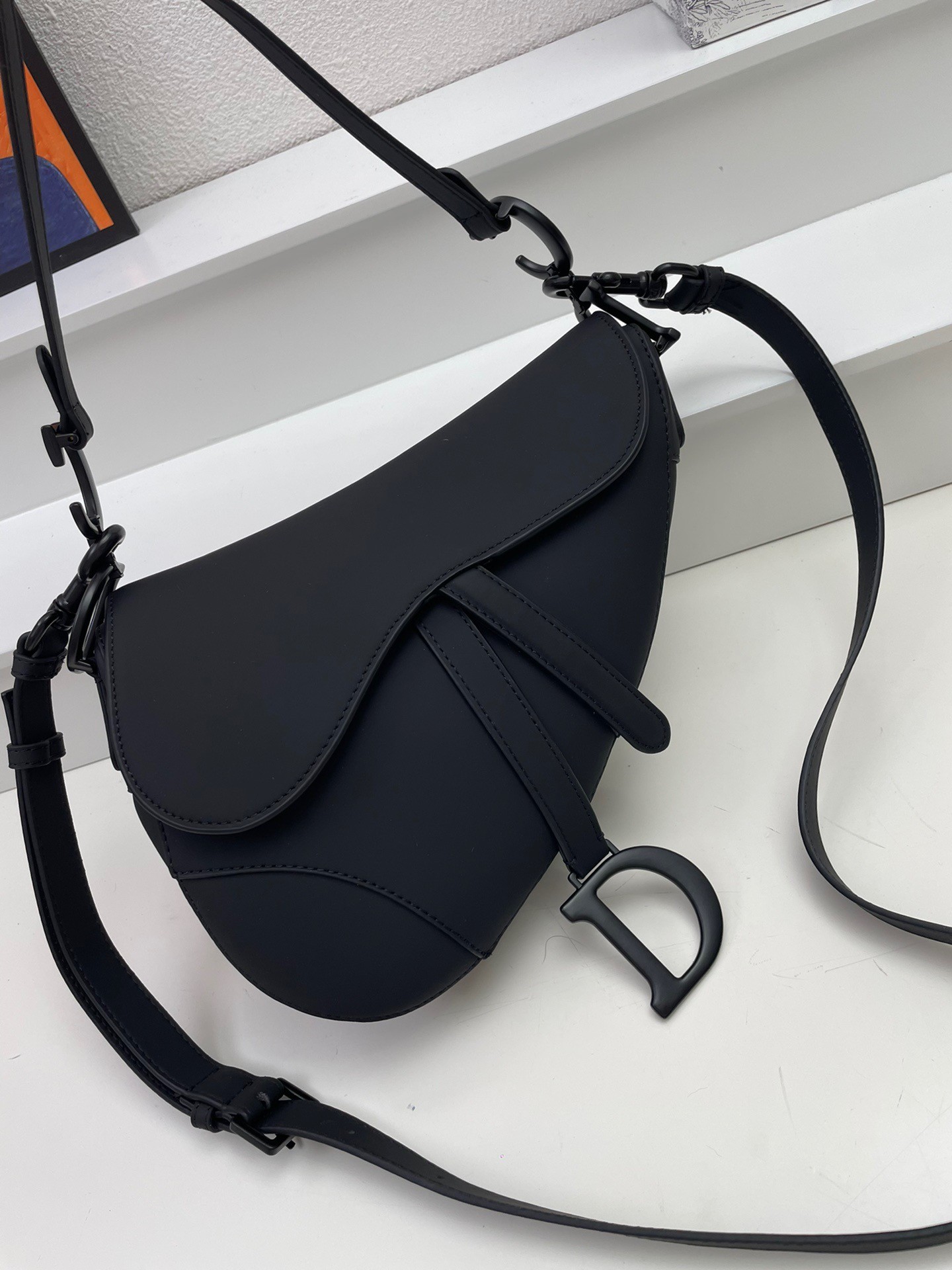 D*or saddle bag with strap in black ultramatte calfskin