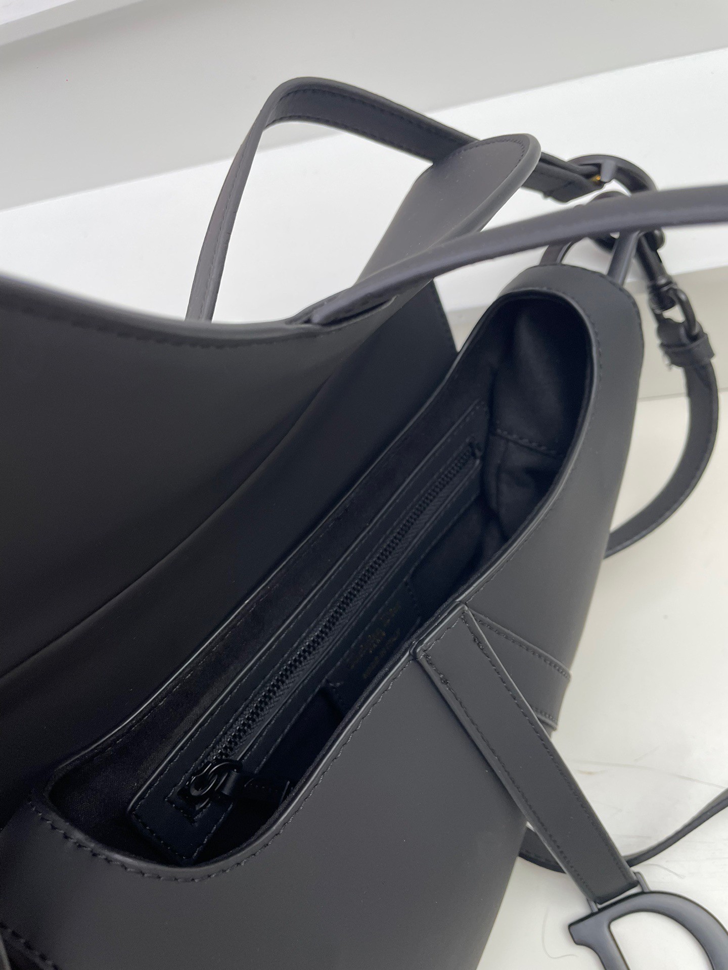 D*or saddle bag with strap in black ultramatte calfskin