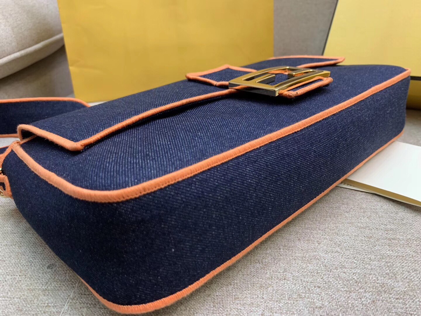 f**di large baguette bag in blue De*1m with orange trim