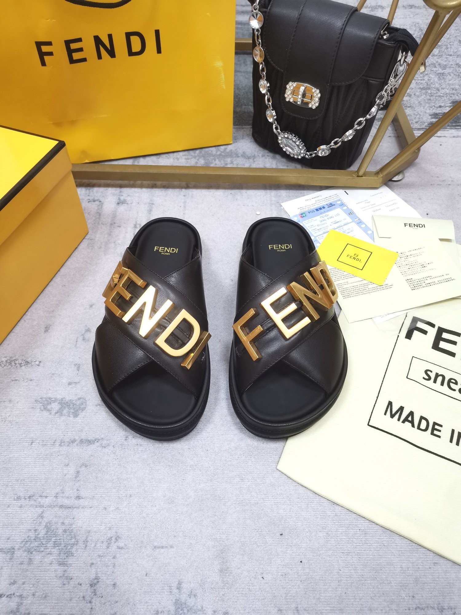 F**di F**digraphy slides in black calfskin