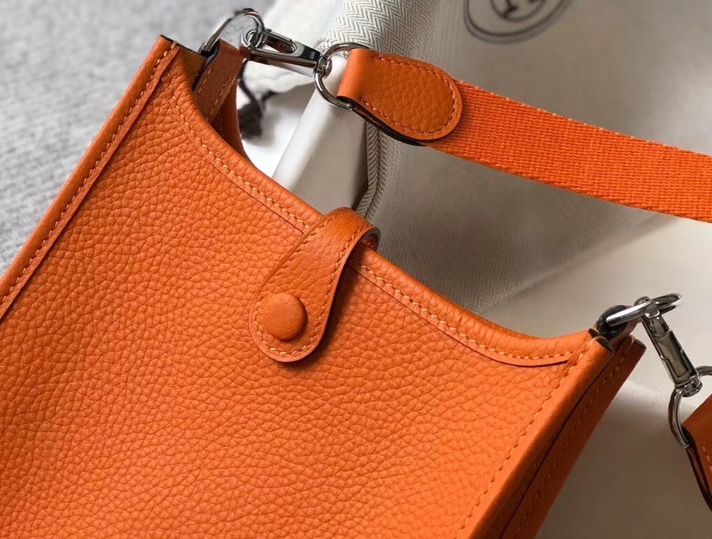 H**mes evelyne iii tpm mini bag in orange clemence leather