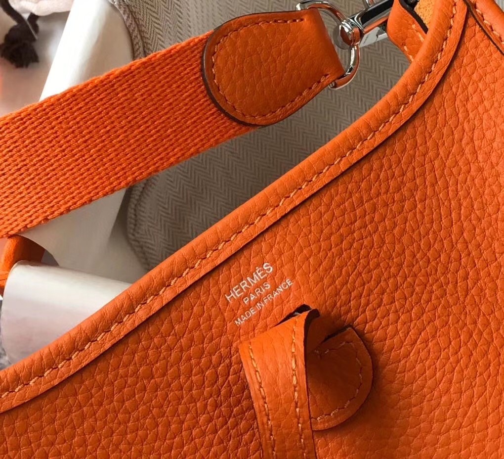 H**mes evelyne iii tpm mini bag in orange clemence leather