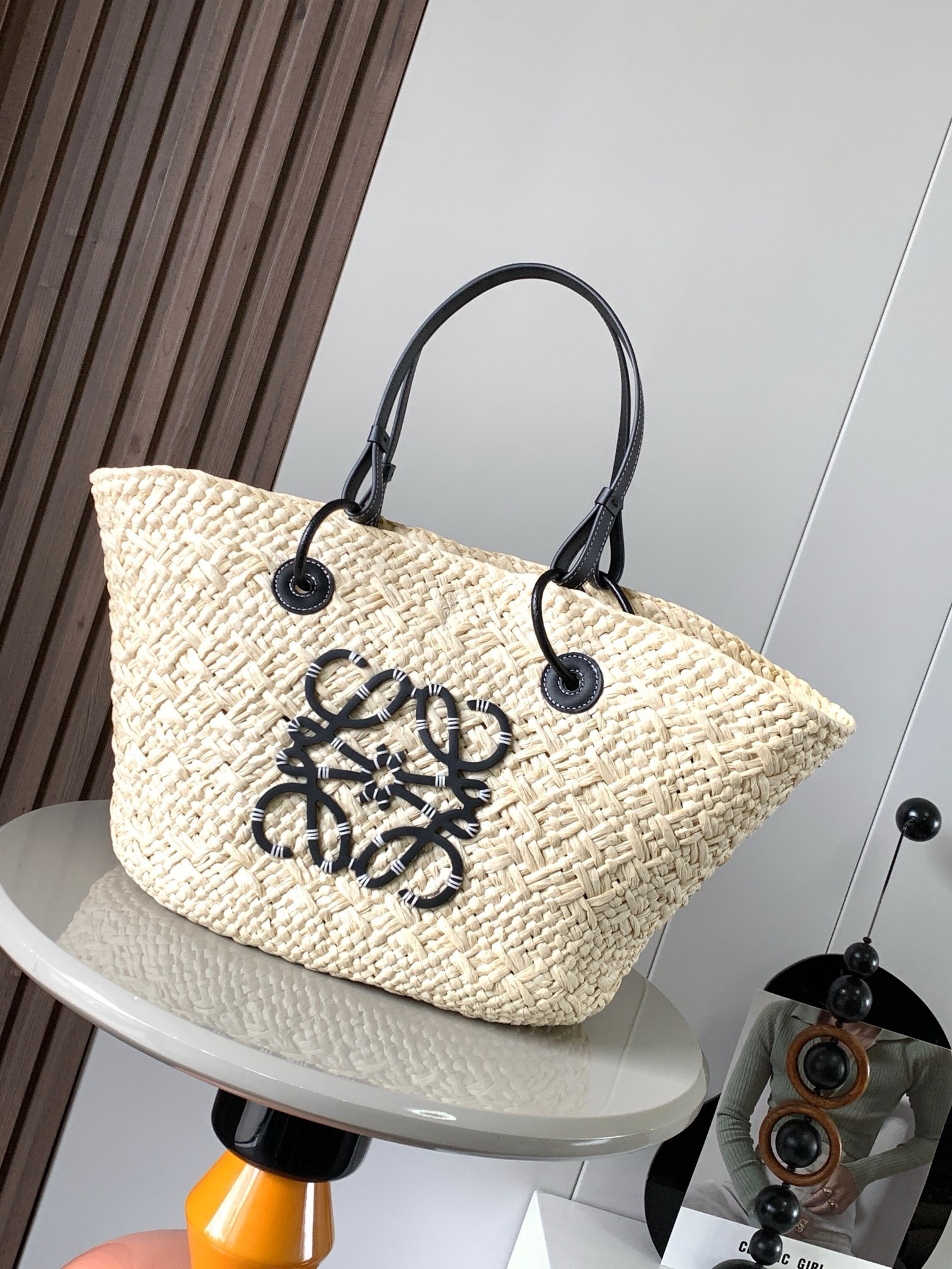 L0ew* medium anagram basket bag in iraca palm and black calfskin