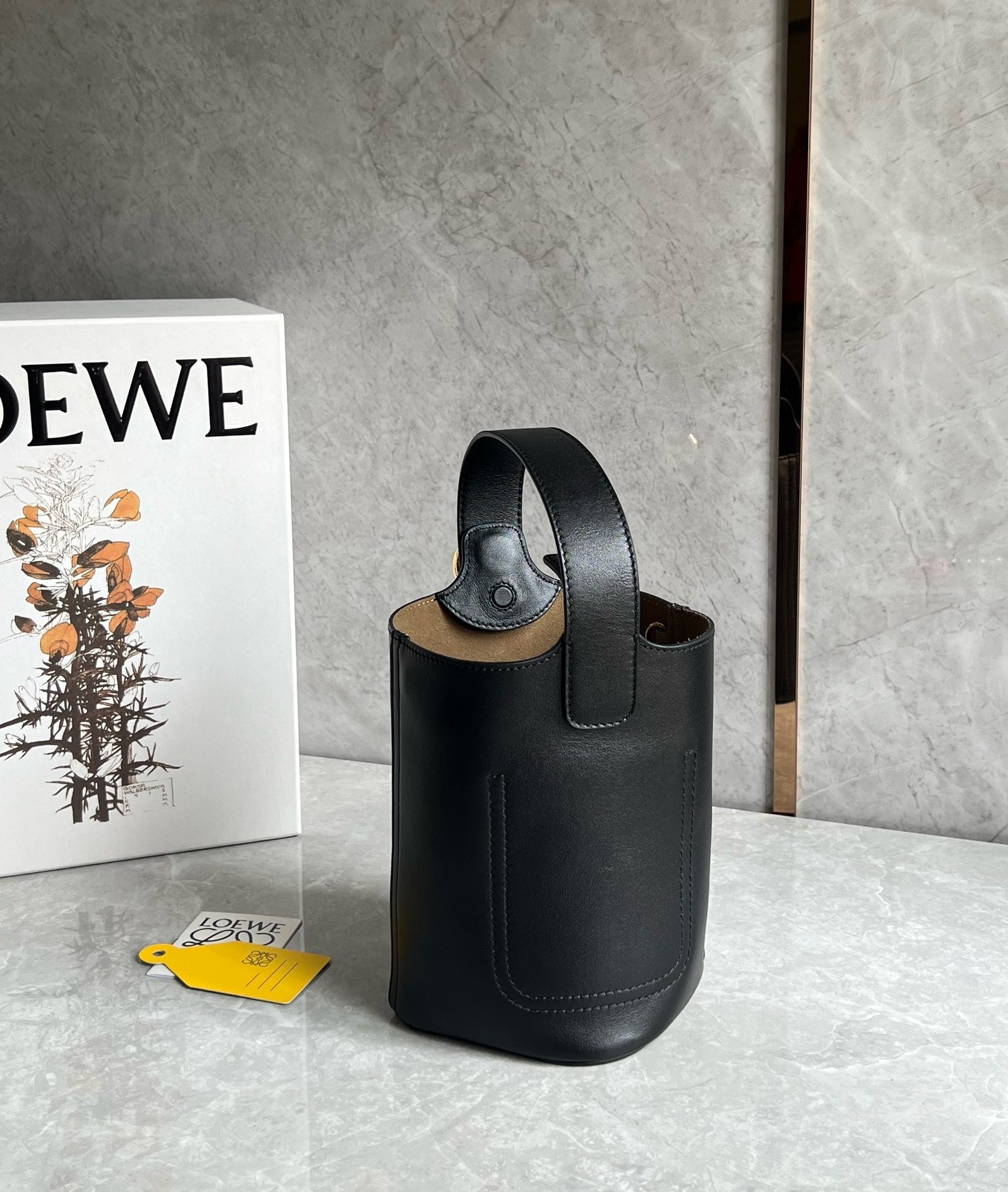 L0ew* mini pebble bucket bag in black calfskin