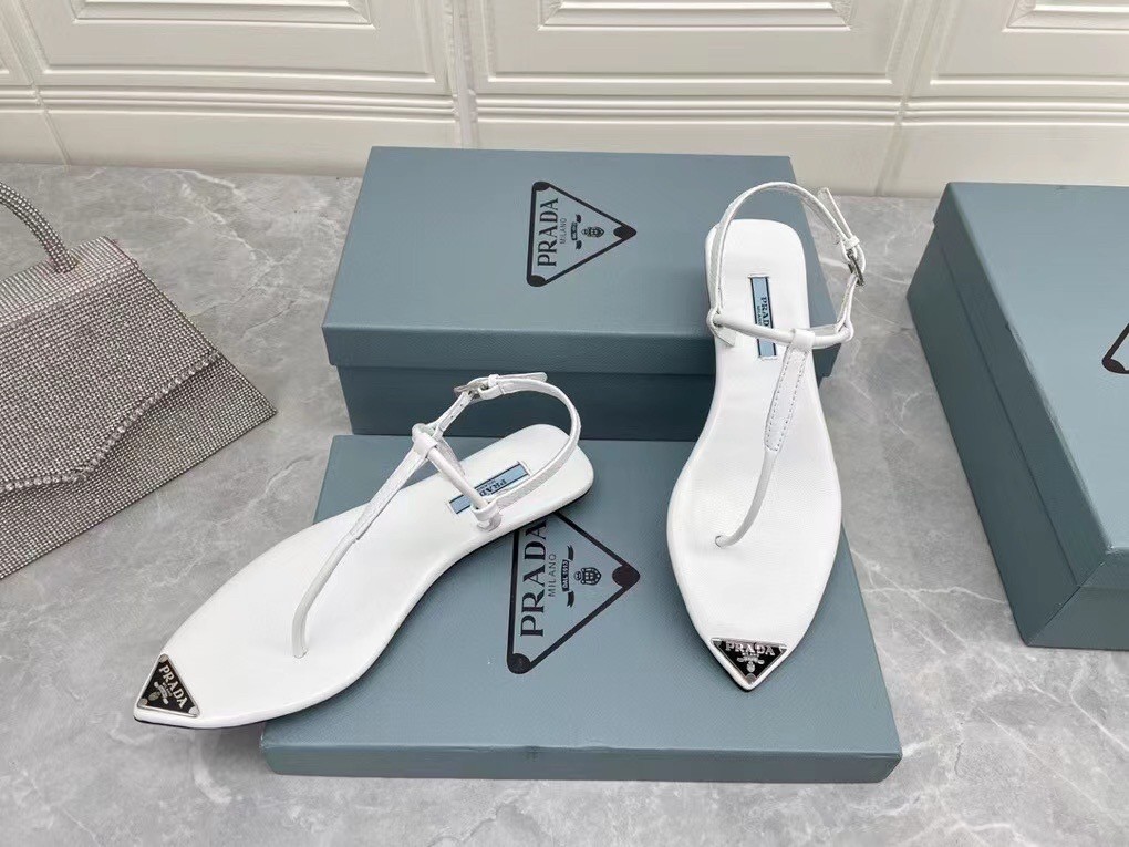 Pra*a thong sandals in white brushed leather