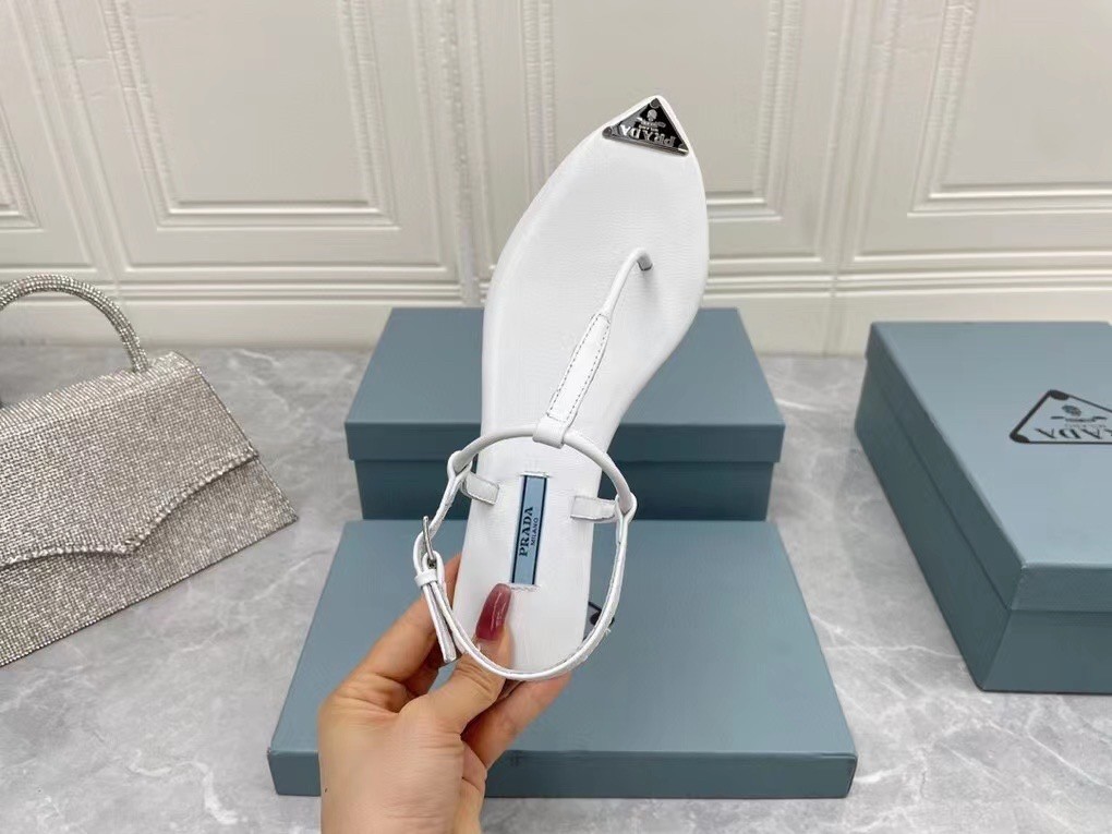 Pra*a thong sandals in white brushed leather