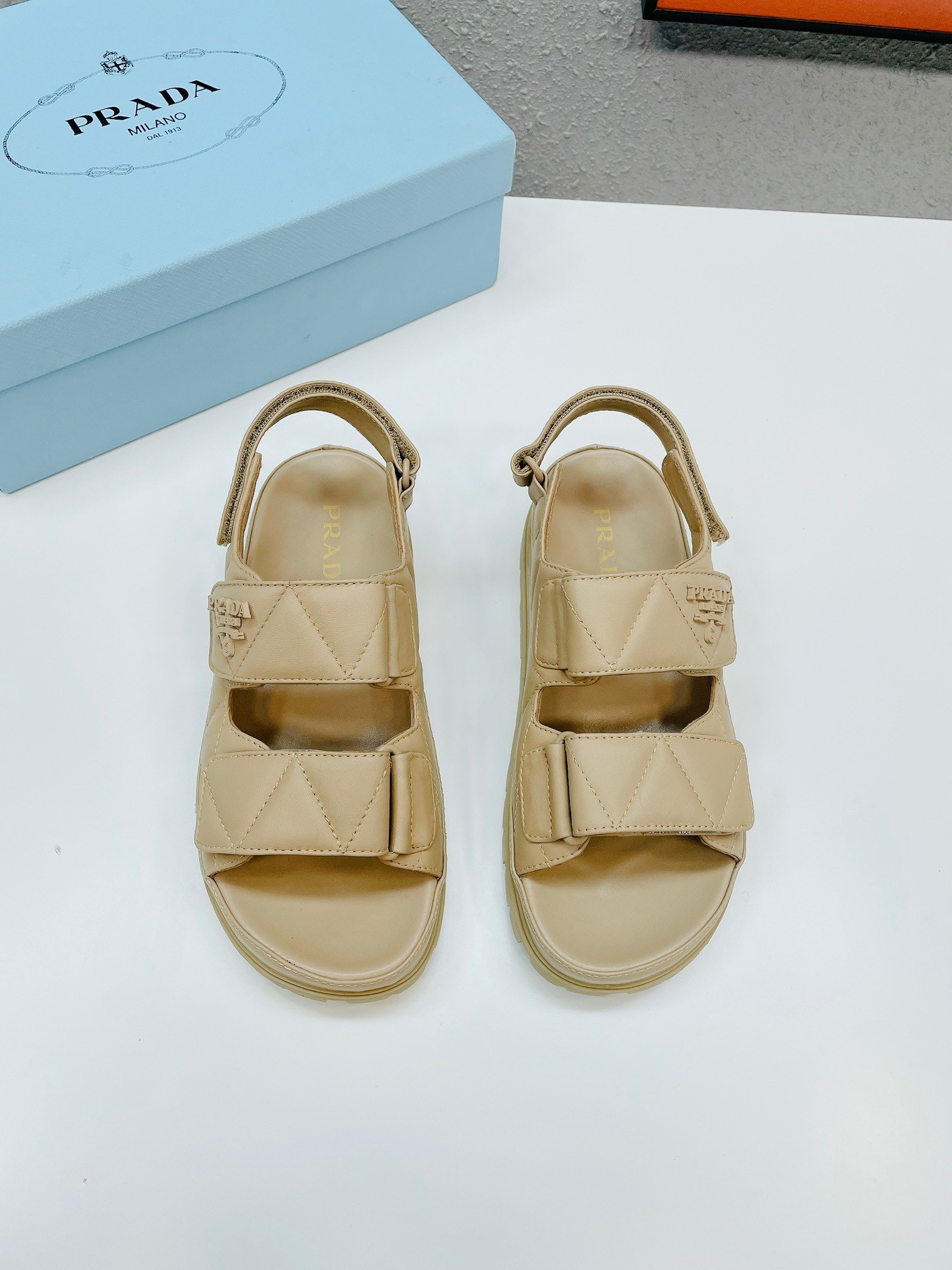 Pra*a padded sandals in beige nappa leather