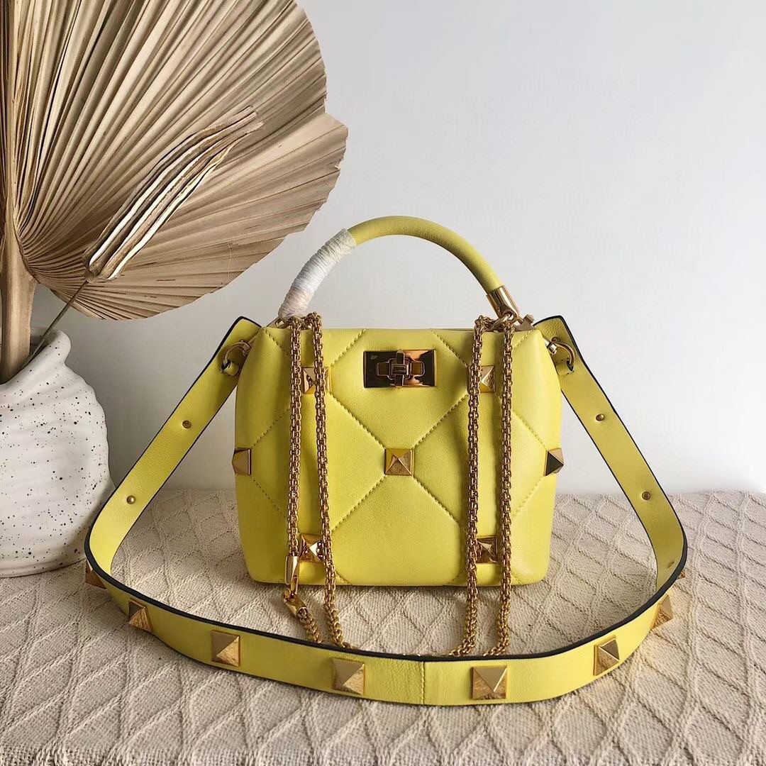 Va1e*ntin0 small roman stud top handle bag in yellow nappa