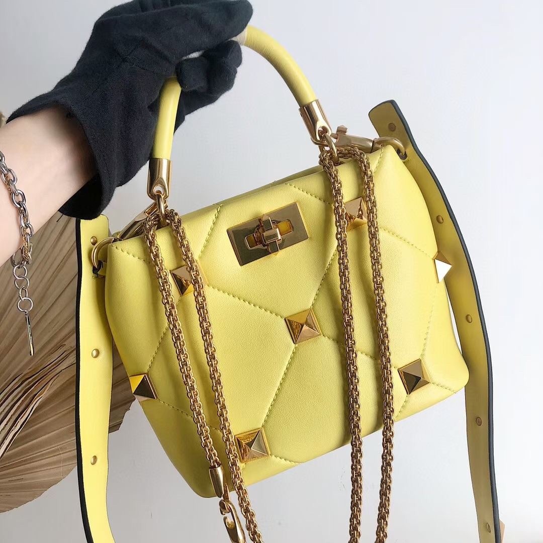 Va1e*ntin0 small roman stud top handle bag in yellow nappa
