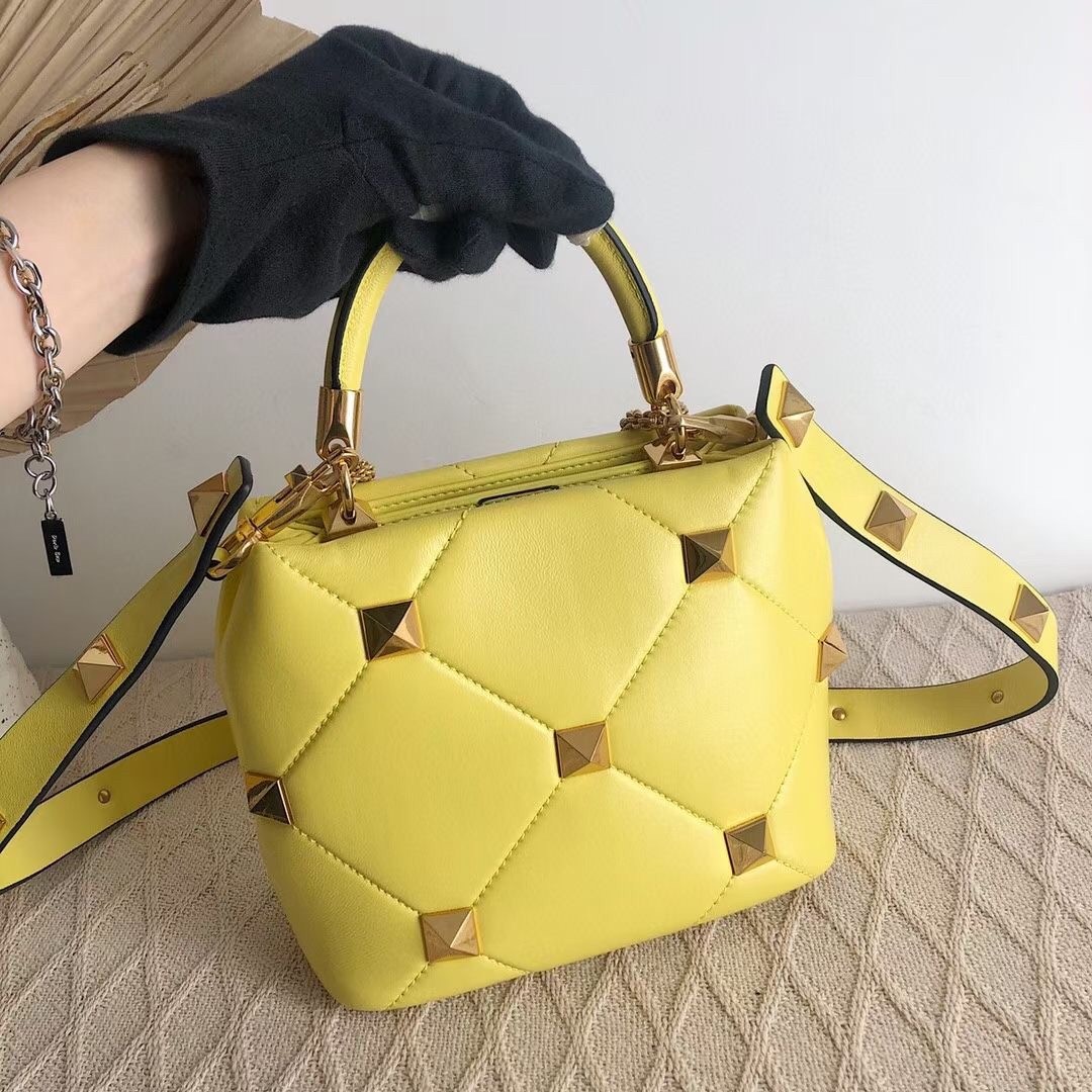 Va1e*ntin0 small roman stud top handle bag in yellow nappa