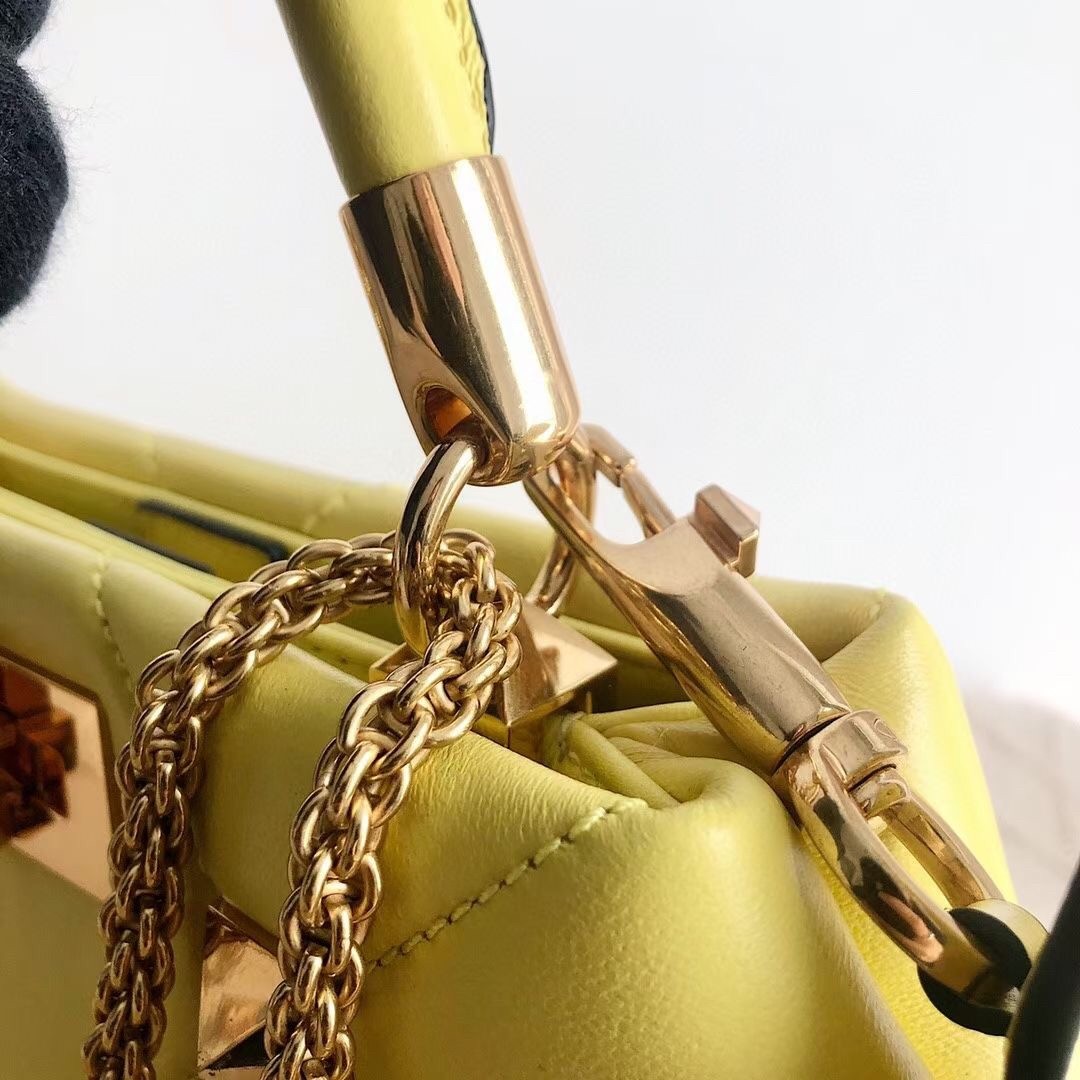 Va1e*ntin0 small roman stud top handle bag in yellow nappa