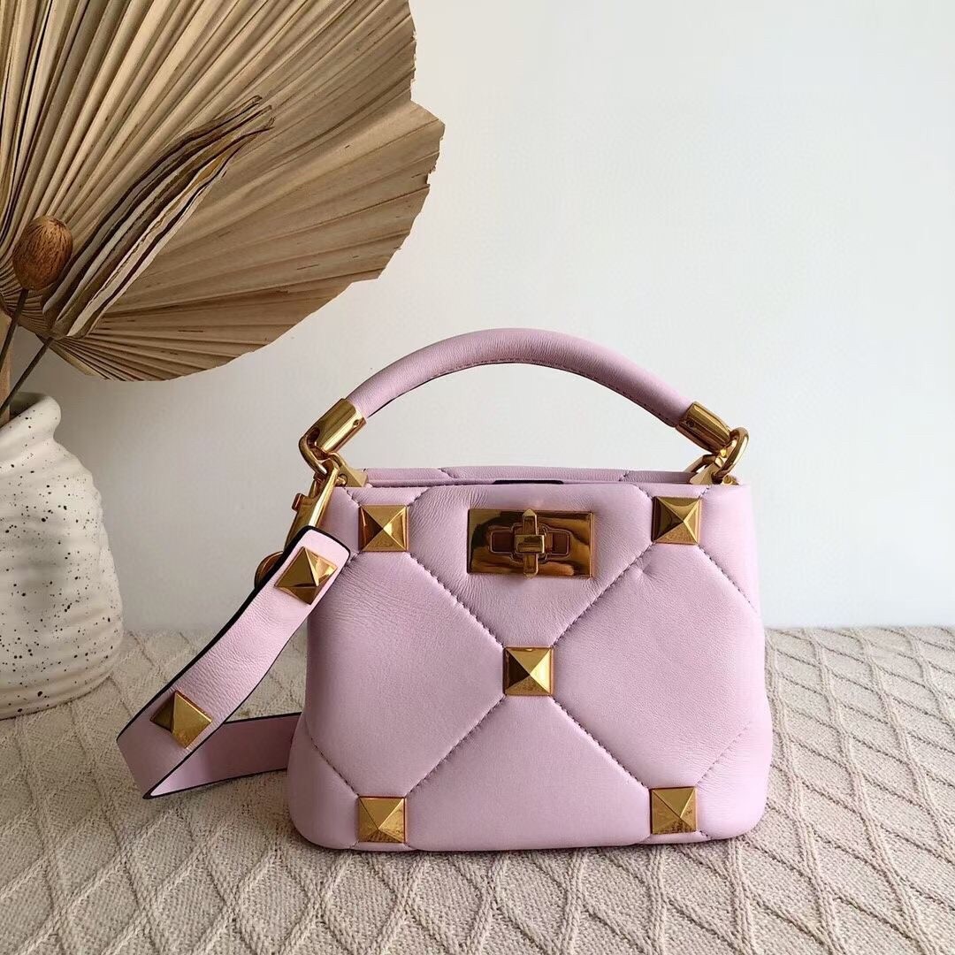 Va1e*ntin0 small roman stud top handle bag in pink nappa