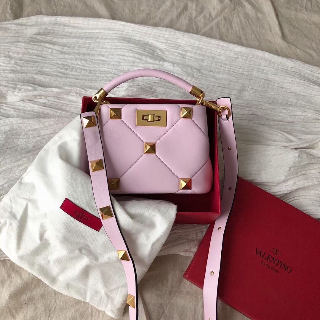 Va1e*ntin0 small roman stud top handle bag in pink nappa