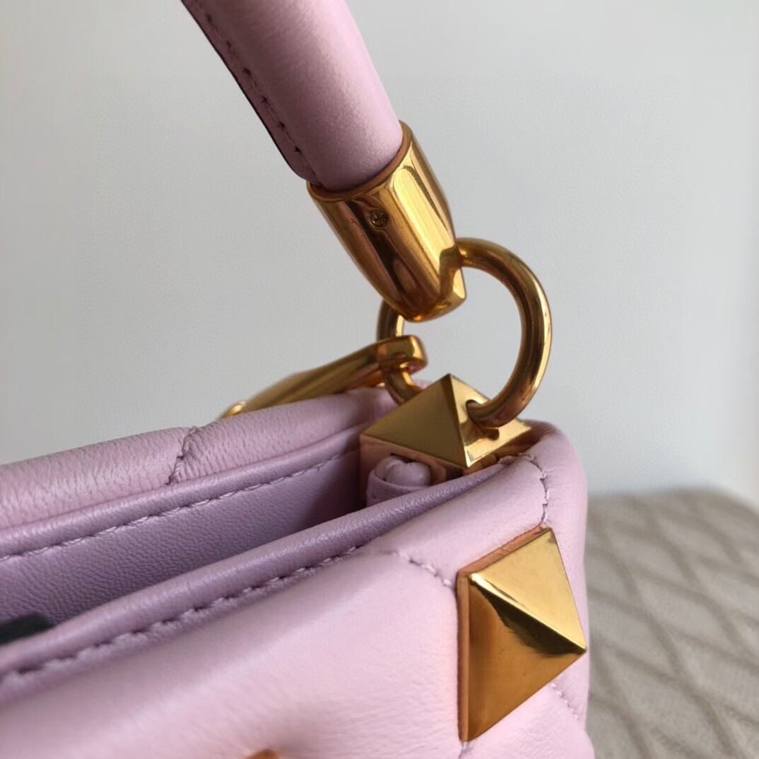 Va1e*ntin0 small roman stud top handle bag in pink nappa
