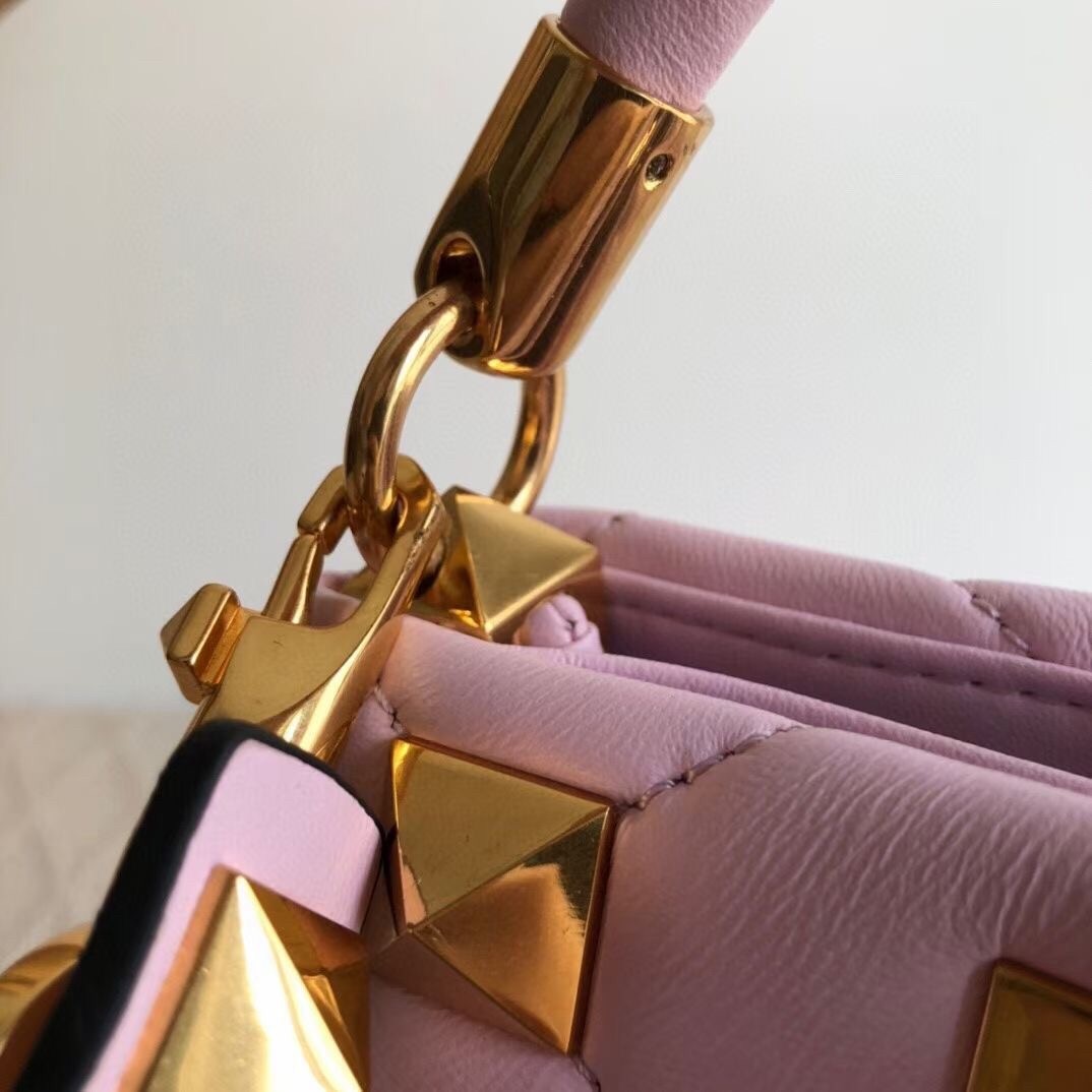 Va1e*ntin0 small roman stud top handle bag in pink nappa
