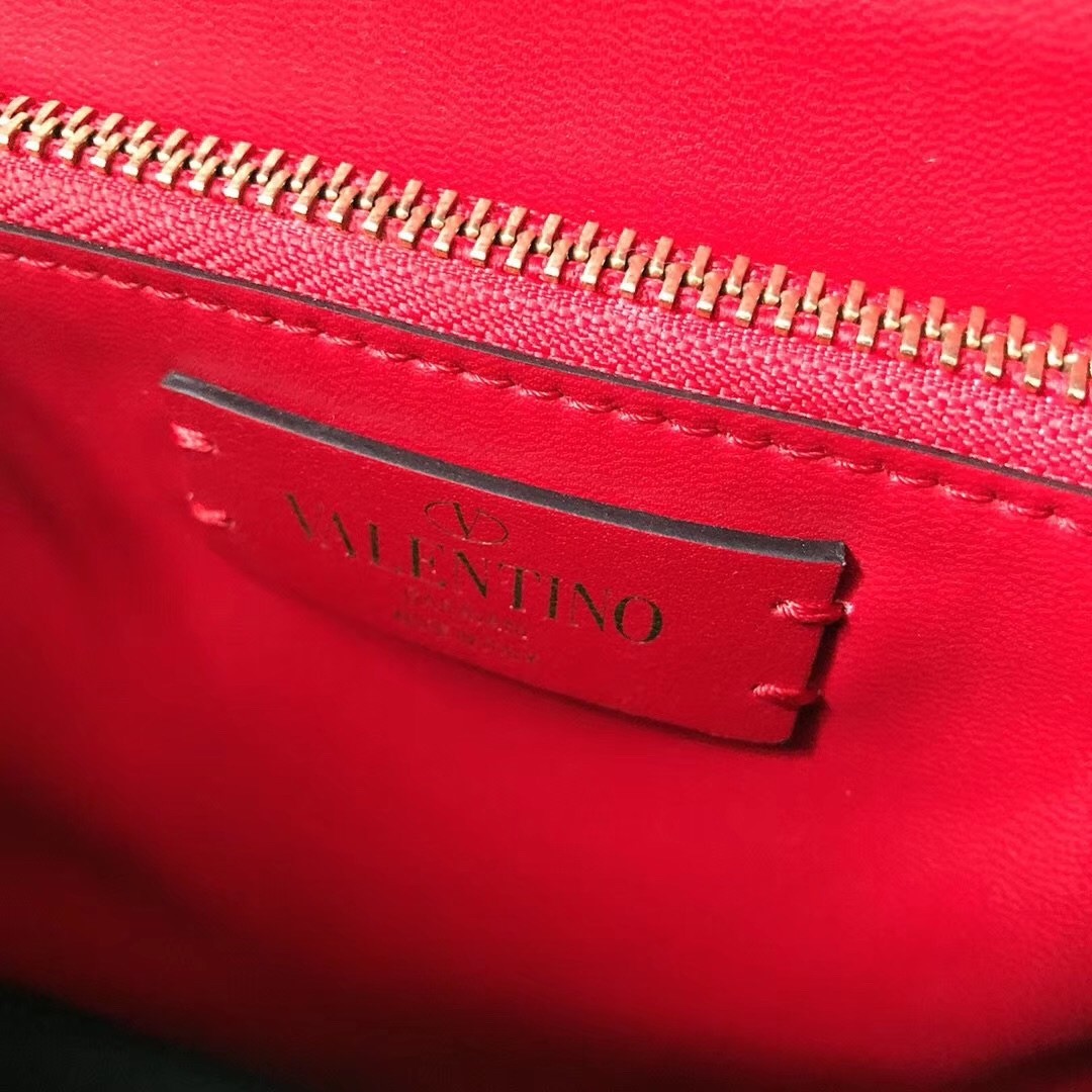 Va1e*ntin0 vsling handbag in black grainy calfskin
