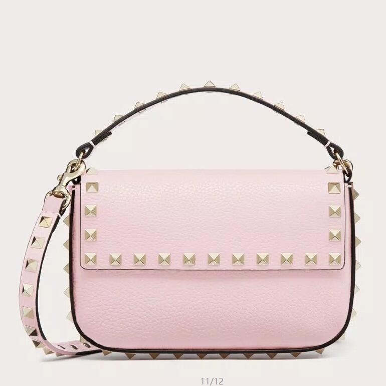 Va1e*ntin0 rockstud pouch bag in pink grained leather